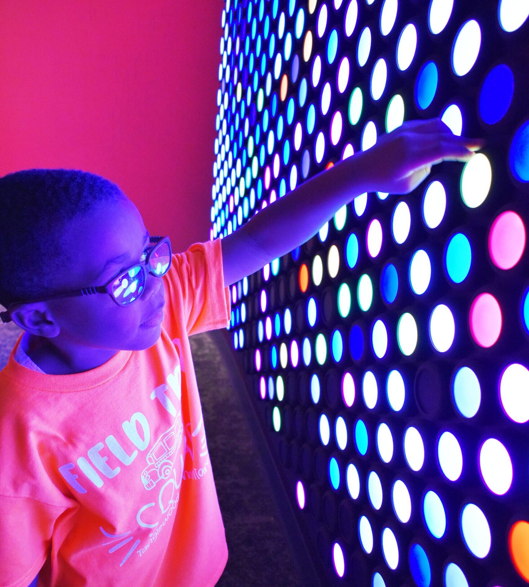 A child exploring the Everbright exhibit in The Seed